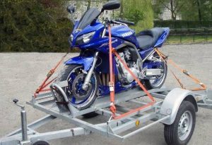 strap a motorcycle to a trailer