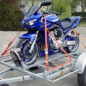 strap a motorcycle to a trailer